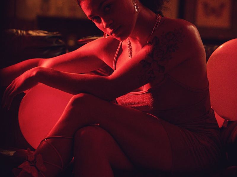 Cinematic shot of a yoga studio with warm red lighting.